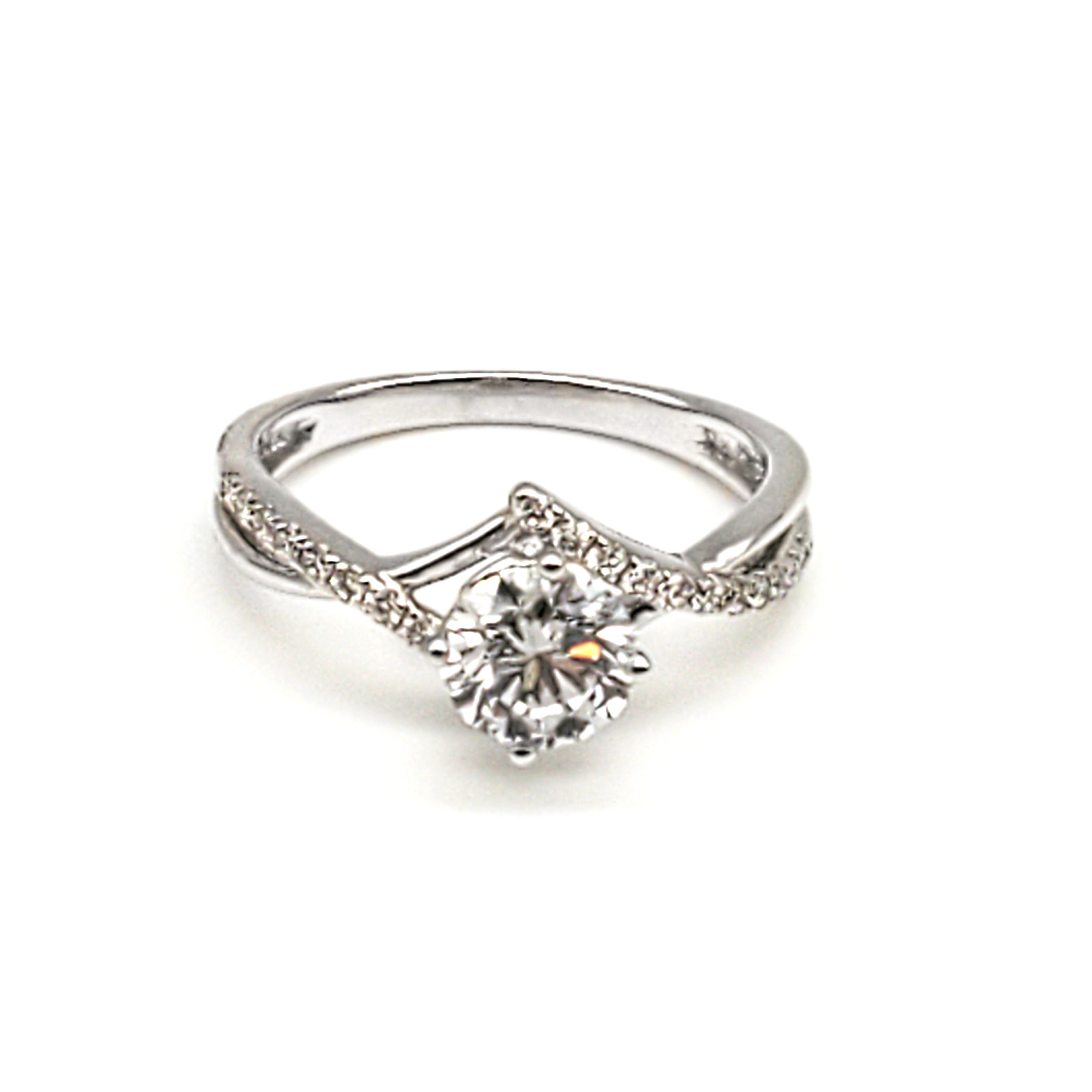 Criss Cross Micro Pavé Diamond Engagement Gold Ring flat lay on white surface