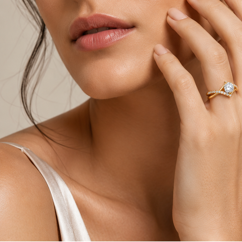 Criss Cross Micro Pavé Diamond Engagement Gold Ring Close-up of a woman's hand with a diamond ring on her finger