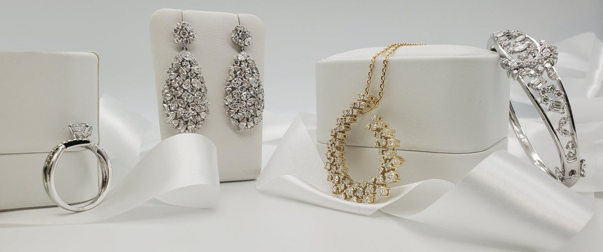 SEMRĀ diamond ring, drop earrings, gold pendant and bangle